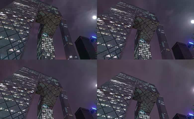 移动夜景延时北京地标中央电视台总部大楼月光云层