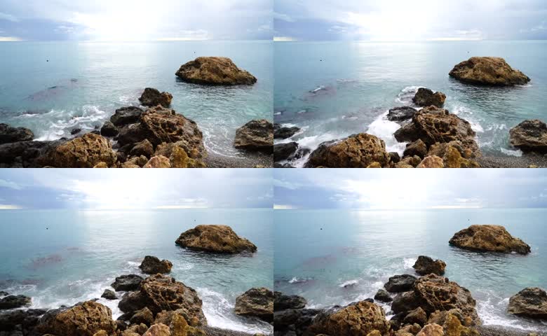 近岸礁石海浪涌动