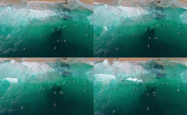 航拍视角海岸冲浪爱好者