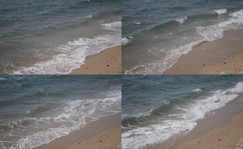 轻柔海浪冲刷沙滩