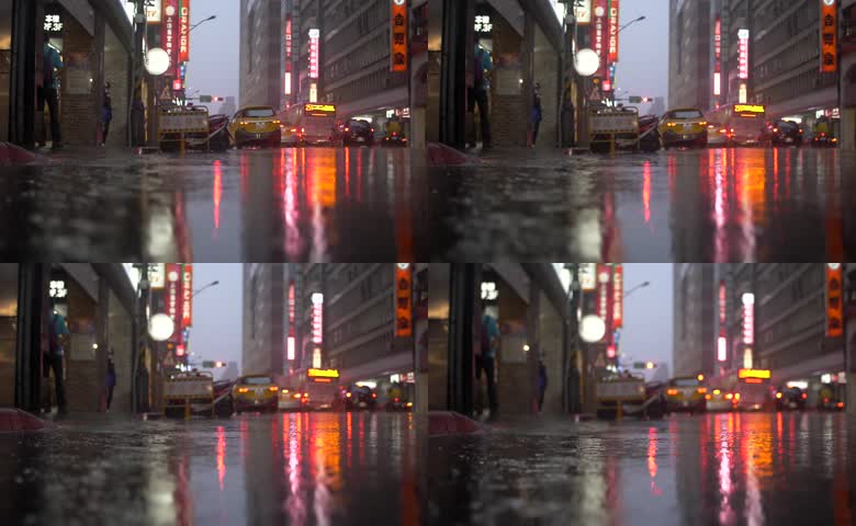 灯光倒映湿滑城市路面