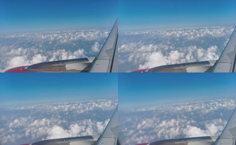 飞机舷窗视角俯瞰高空云海