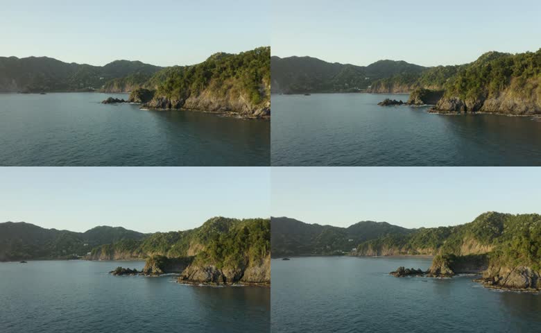 葱郁山林海岸平静海景