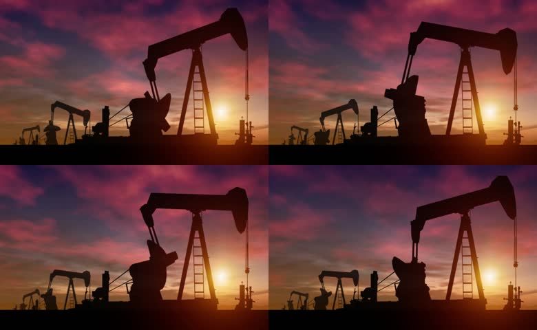 夕阳美景下的磕头机剪影