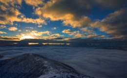丁达尔光雪山云海日出