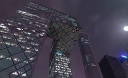 移动夜景延时北京地标中央电视台总部大楼月光云层