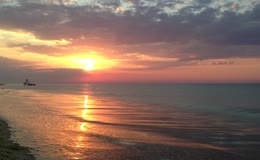 夕阳太阳红日落日海滩海浪海洋