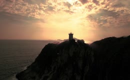 夕阳灯塔阳光海洋